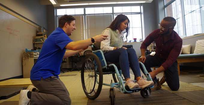 RST students working on wheelchair.